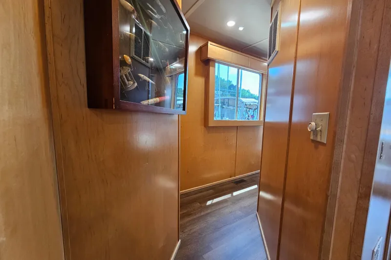 Slide: The Image of Narrow hallway with wooden walls, display case, and window in a Fantasy 18x80 model, 2001. - 43