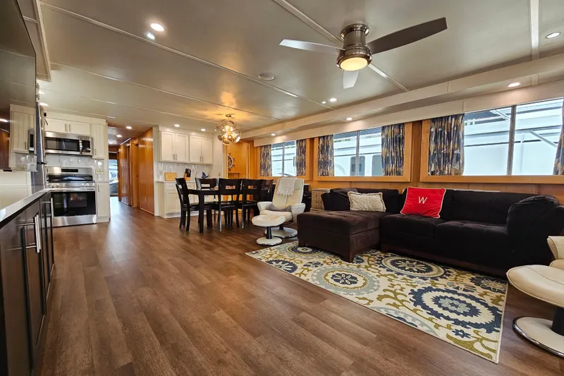 Slide: The Image of Luxurious houseboat interior with modern kitchen, dining area, and cozy living space, Fantasy 18x80 model. - 7