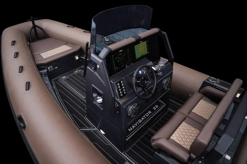 Slide: The Image of 2025 Brig Navigator 26 boat interior with modern dashboard and luxurious seating. - 11