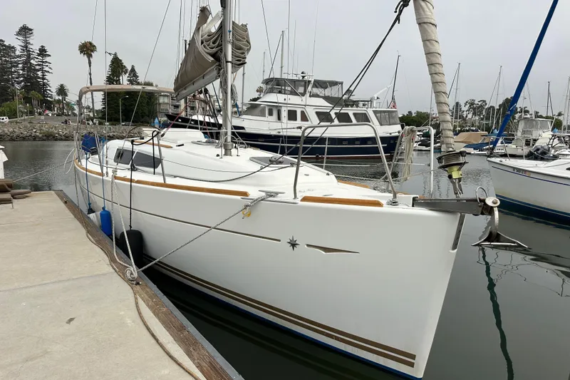 Slide: The Image of Sailboat Jeanneau Sun Odyssey 33i, 2011 model, docked in a marina. - 16
