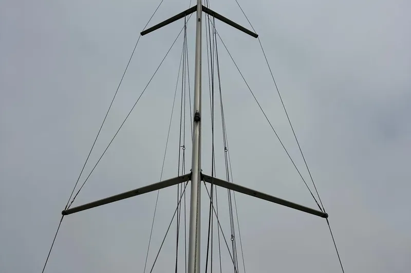Slide: The Image of Mast of 2011 Jeanneau Sun Odyssey 33i sailboat against cloudy sky. - 28