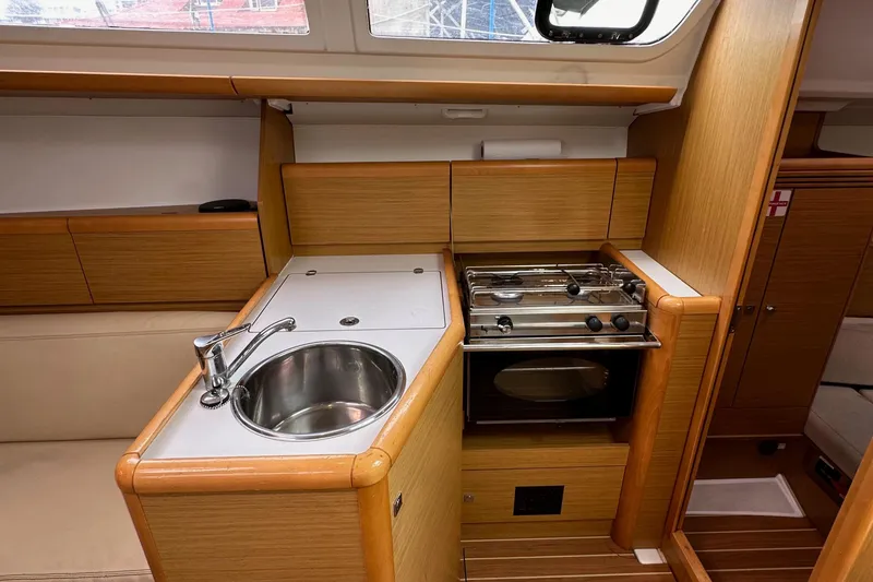 Slide: The Image of Interior of 2011 Jeanneau Sun Odyssey 33i yacht kitchen with sink and stove. - 42