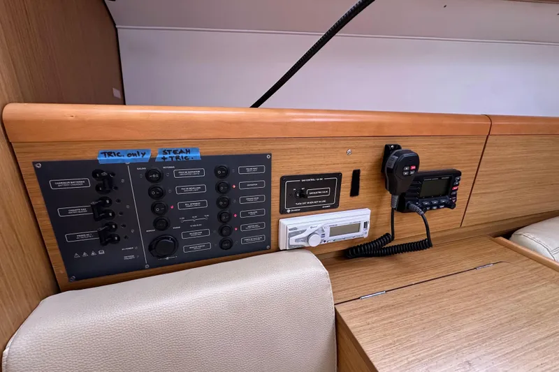 Slide: The Image of Control panel of 2011 Jeanneau Sun Odyssey 33i sailboat with navigation and communication equipment. - 48