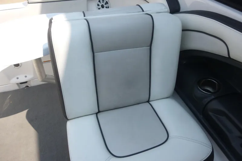 Slide: The Image of 2014 Yamaha Boats 240 interior seat with gray and black upholstery. - 11