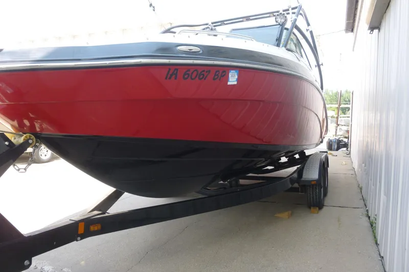 Slide: The Image of 2014 Yamaha Boats 240, red and black, on trailer, parked outdoors. - 4