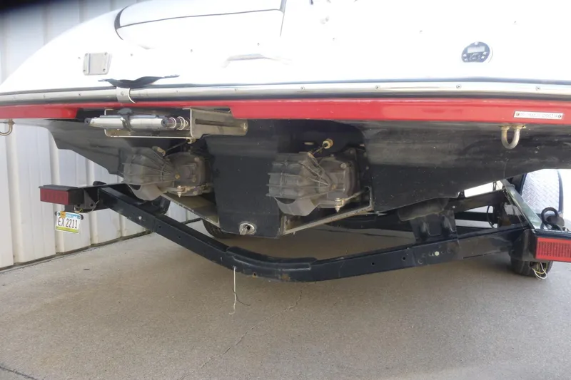 Slide: The Image of Rear view of a 2014 Yamaha Boats 240 on a trailer, showing dual jet drives. - 5