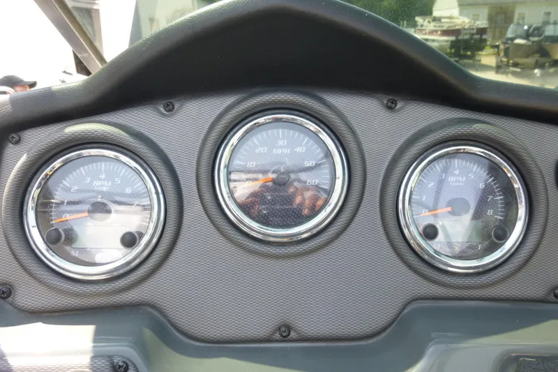 Slide: The Image of Dashboard of a 2014 Yamaha Boats 240, featuring speedometer and RPM gauges. - 7