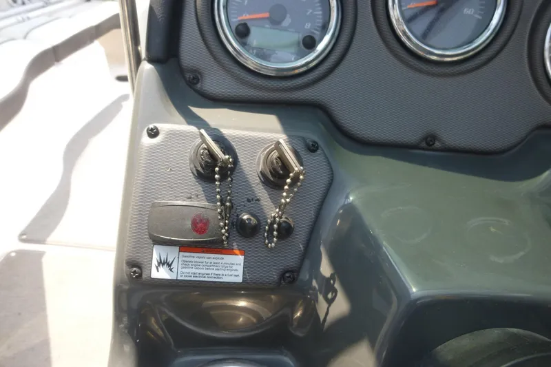 Slide: The Image of Dashboard of a 2014 Yamaha Boats 240 with ignition switches and gauges. - 9