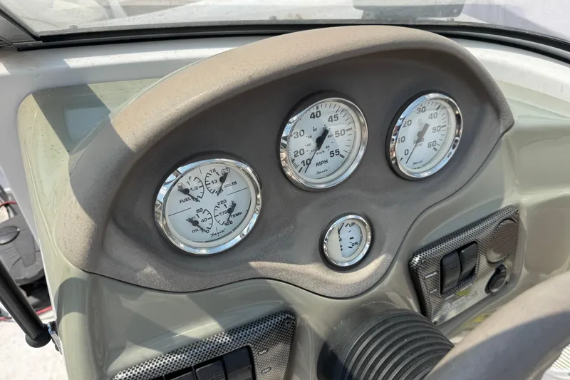 Slide: The Image of Dashboard of 2008 Four Winns H203 boat with gauges and controls. - 15