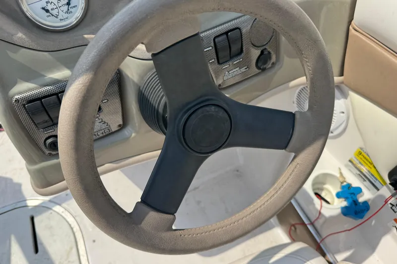 Slide: The Image of Steering wheel and dashboard of 2008 Four Winns H203 boat. - 17
