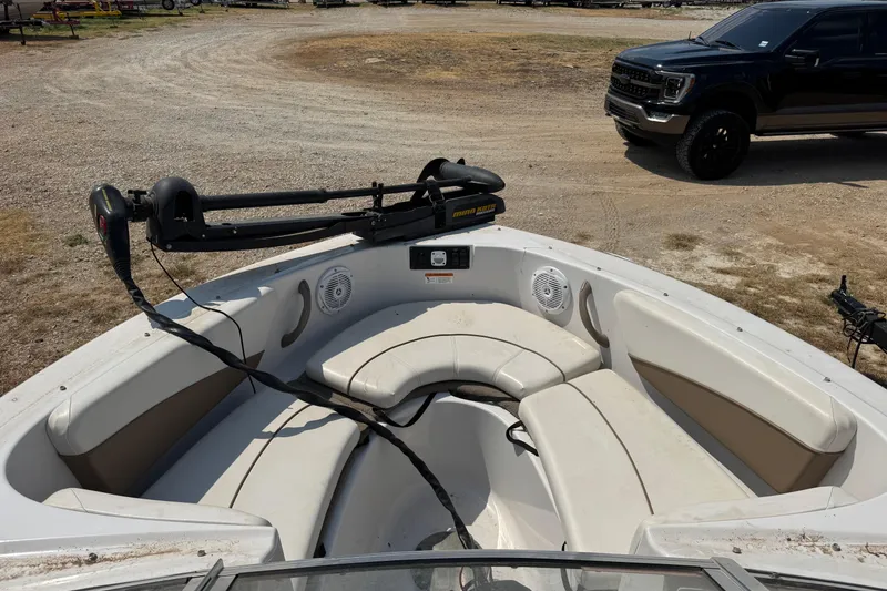 Slide: The Image of 2008 Four Winns H203 boat interior with seating and trolling motor. - 20
