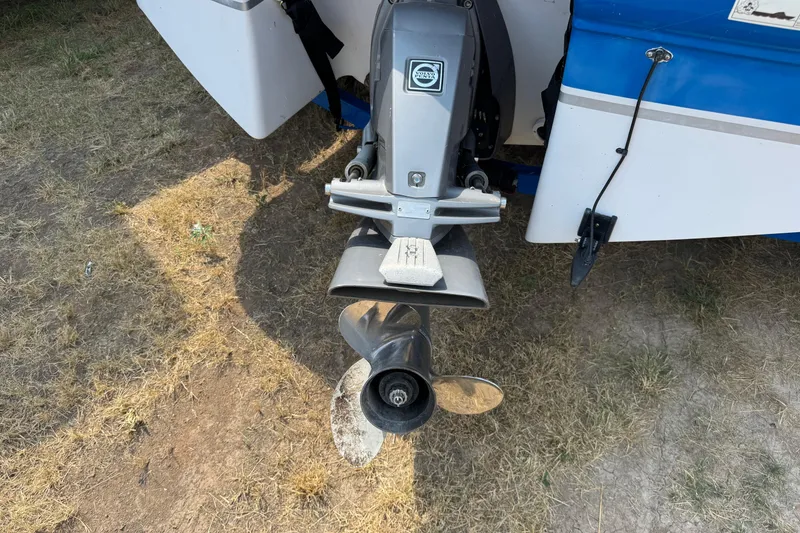 Slide: The Image of Rear view of a 2008 Four Winns H203 boat with visible propeller and motor. - 8