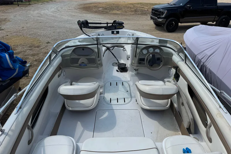 Slide: The Image of 2008 Four Winns H203 boat interior with steering wheel and seating. - 9