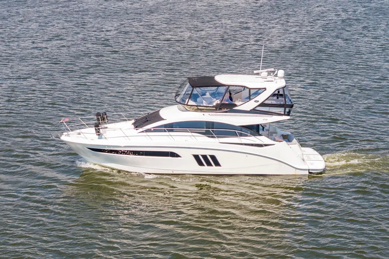 Slide: The Image of 2017 Sea Ray Fly 510 yacht cruising on open water. - 1