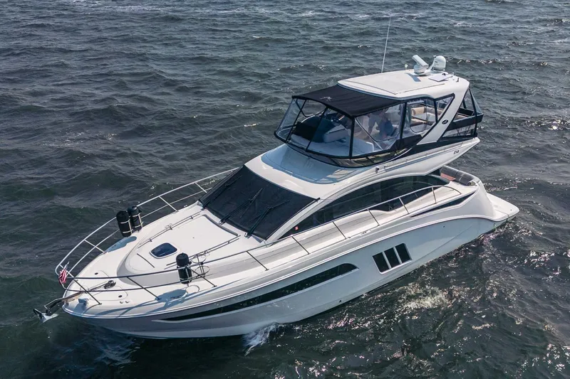 Slide: The Image of 2017 Sea Ray Fly 510 yacht cruising on open water. - 10