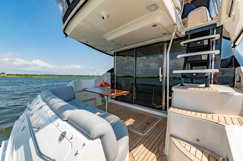 Slide: The Image of Luxurious 2017 Sea Ray Fly 510 yacht with spacious deck and elegant seating. - 16