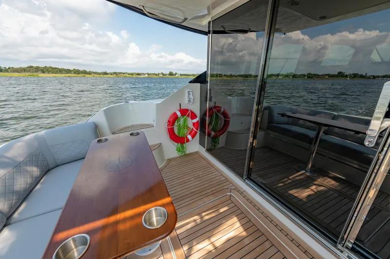 Slide: The Image of Luxurious 2017 Sea Ray Fly 510 yacht interior with scenic water view. - 20