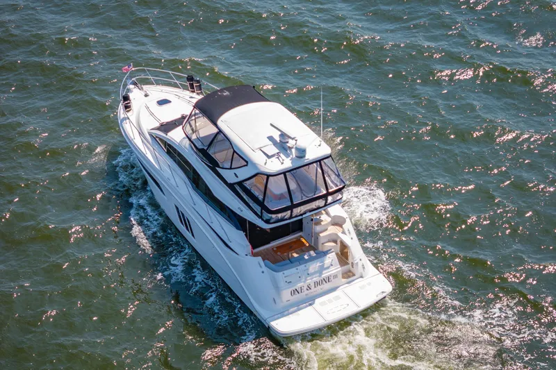 Slide: The Image of 2017 Sea Ray Fly 510 yacht cruising on open water, aerial view. - 3