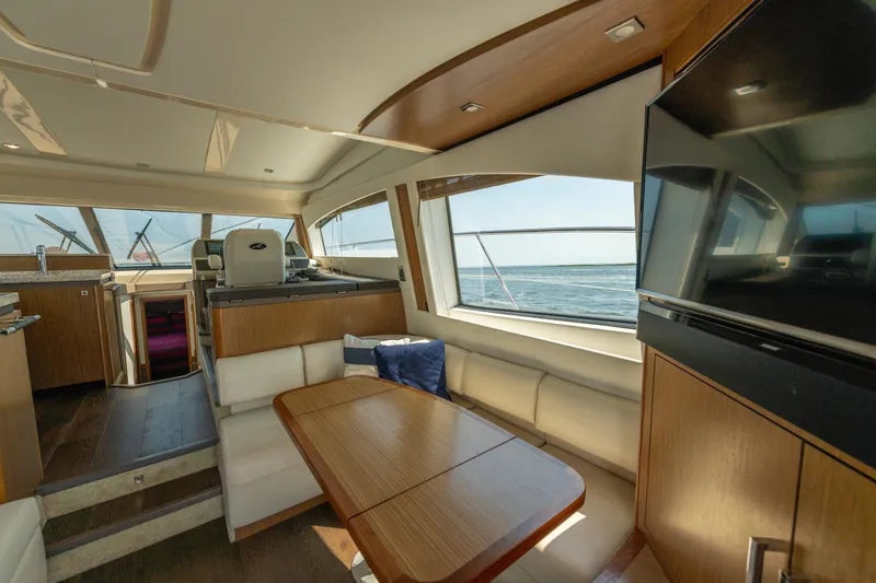 Slide: The Image of Luxurious interior of 2017 Sea Ray Fly 510 yacht with elegant seating and ocean view. - 31