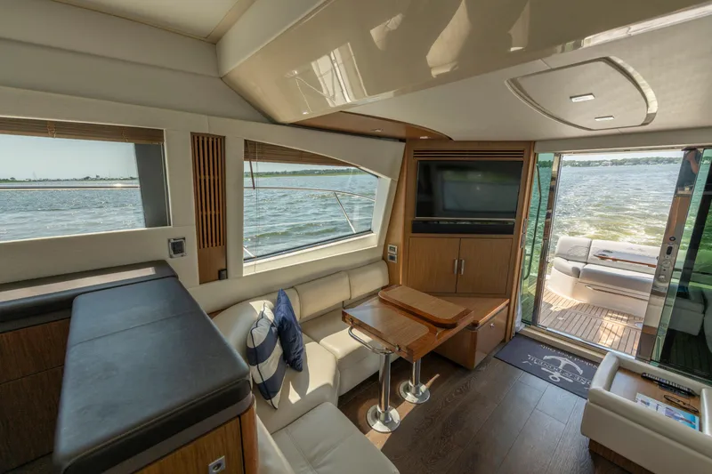 Slide: The Image of Luxurious interior of 2017 Sea Ray Fly 510 yacht with elegant seating and scenic water views. - 33