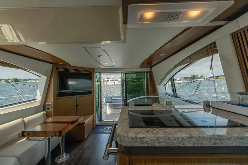 Slide: The Image of Luxurious interior of 2017 Sea Ray Fly 510 yacht with modern amenities and scenic water views. - 37