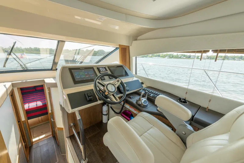 Slide: The Image of Luxurious helm of 2017 Sea Ray Fly 510 yacht with modern controls and panoramic view. - 39