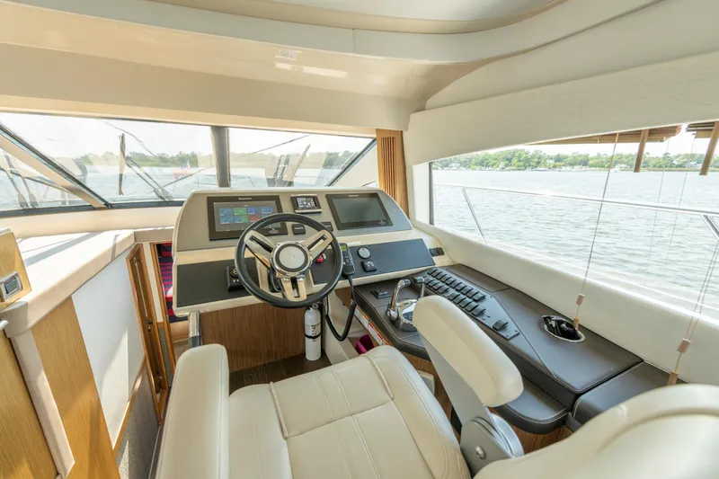 Slide: The Image of Luxurious helm of 2017 Sea Ray Fly 510 yacht with modern controls and panoramic view. - 40