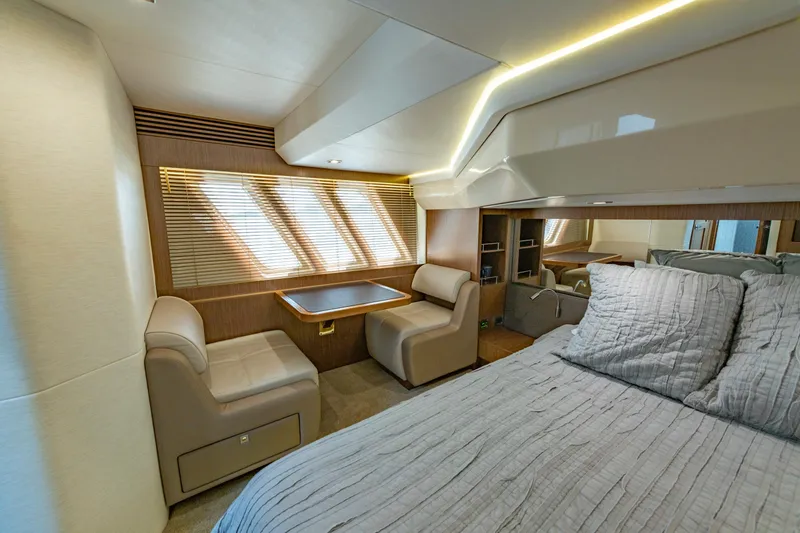 Slide: The Image of Luxurious 2017 Sea Ray Fly 510 yacht interior with elegant seating and cozy bed. - 50