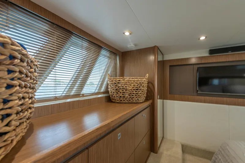 Slide: The Image of Luxurious interior of 2017 Sea Ray Fly 510 yacht with wooden cabinetry and woven basket. - 54