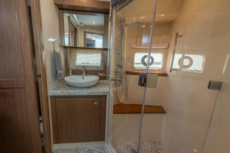 Slide: The Image of Luxurious bathroom in 2017 Sea Ray Fly 510 yacht with modern fixtures and shower. - 57