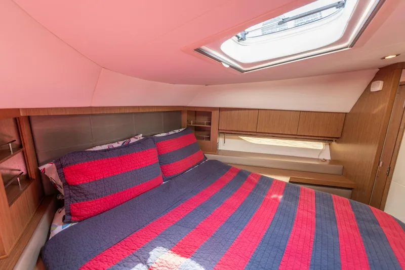 Slide: The Image of Luxurious cabin interior of 2017 Sea Ray Fly 510 yacht with striped bedding. - 59