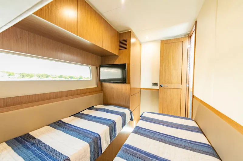 Slide: The Image of Interior of 2017 Sea Ray Fly 510 yacht with twin beds and TV. - 67
