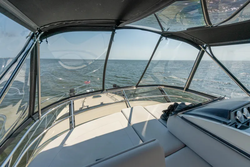 Slide: The Image of Interior view of 2017 Sea Ray Fly 510 yacht overlooking the ocean. - 77