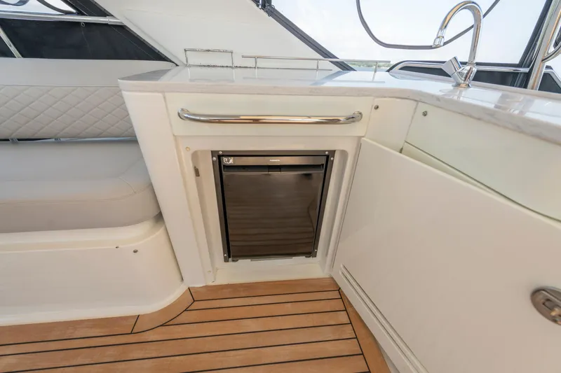 Slide: The Image of Luxurious interior of 2017 Sea Ray Fly 510 yacht with sleek kitchenette design. - 81