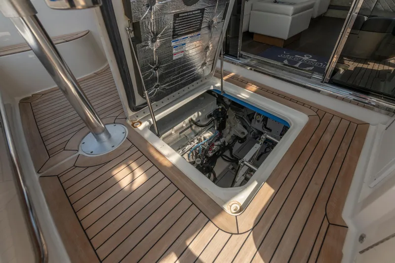 Slide: The Image of Engine compartment of 2017 Sea Ray Fly 510 yacht with teak flooring. - 86