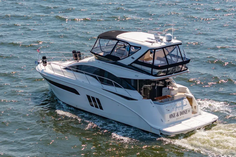 Slide: The Image of 2017 Sea Ray Fly 510 yacht cruising on open water, rear view. - 9