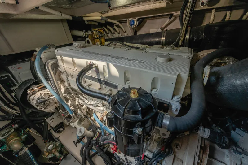 Slide: The Image of Engine room of a 2017 Sea Ray Fly 510 yacht, showcasing detailed machinery. - 90