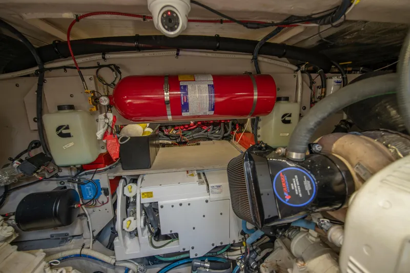 Slide: The Image of Engine room of a 2017 Sea Ray Fly 510 yacht, featuring mechanical components and wiring. - 92