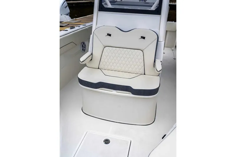 Slide: The Image of Manufacturer Provided Image: 2025 Stingray 253 CC boat interior with cushioned seating. - 23