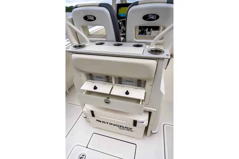 Slide: The Image of Manufacturer Provided Image: 2025 Stingray 253 CC boat interior with storage compartments and seating. - 26