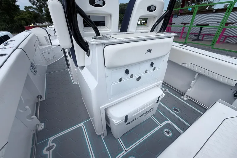 Slide: The Image of 2025 Stingray 253 CC boat interior with seating and storage compartments. - 8