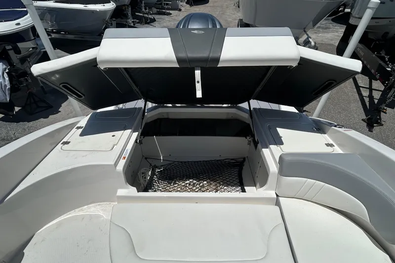 Slide: The Image of 2023 Chaparral 23 SSi OB boat interior with open storage compartment. - 12