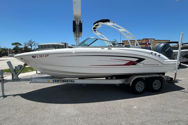 Slide: The Image of 2023 Chaparral 23 SSi OB boat on trailer under clear sky. - 3