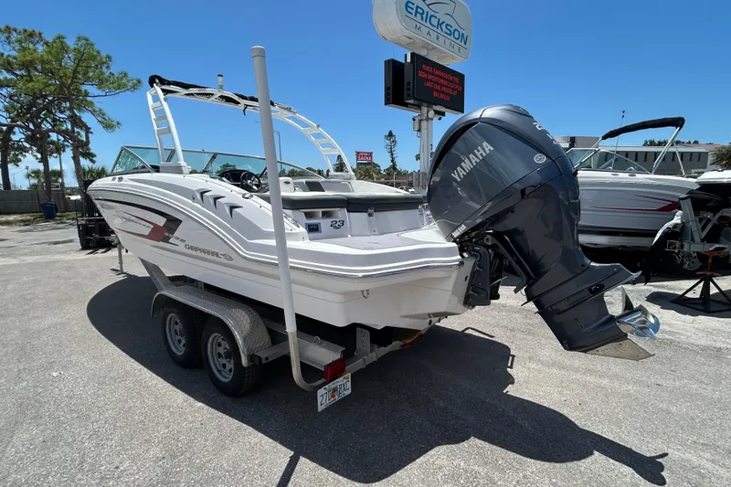 Slide: The Image of 2023 Chaparral 23 SSi OB boat with Yamaha outboard motor on trailer at dealership. - 4