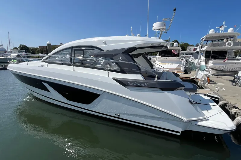 Slide: The Image of 2026 Beneteau Gran Turismo 41 yacht docked at marina under clear blue sky. - 12