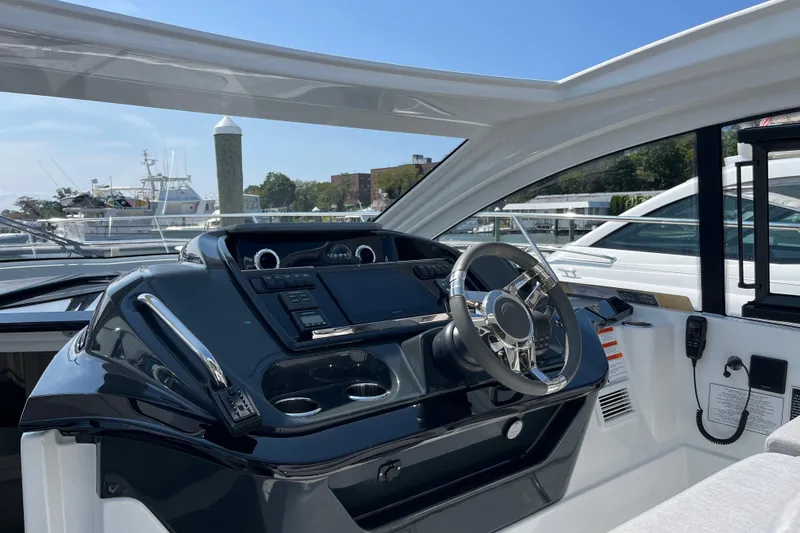 Slide: The Image of 2026 Beneteau Gran Turismo 41 yacht helm with modern controls and sleek design. - 14
