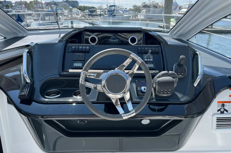 Slide: The Image of Helm of 2026 Beneteau Gran Turismo 41 yacht with modern controls and steering wheel. - 15
