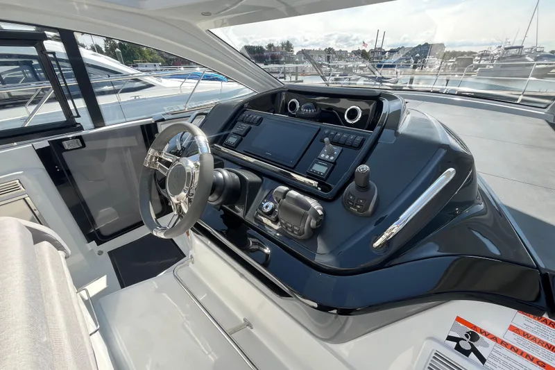 Slide: The Image of 2026 Beneteau Gran Turismo 41 yacht helm with modern controls and sleek design. - 16