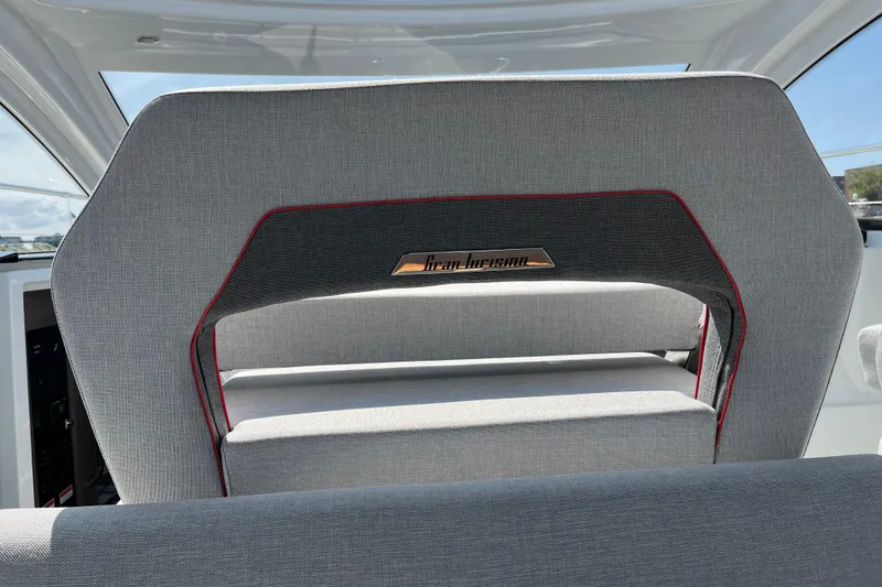 Slide: The Image of 2026 Beneteau Gran Turismo 41 interior with stylish gray seating and red accents. - 20