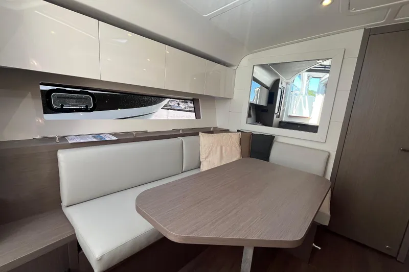 Slide: The Image of Interior of 2026 Beneteau Gran Turismo 41 yacht, featuring modern seating and sleek design. - 29